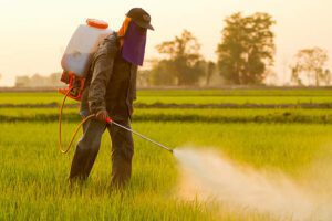 Dragon Breath Near Me - Farmer spraying farm with pesticides